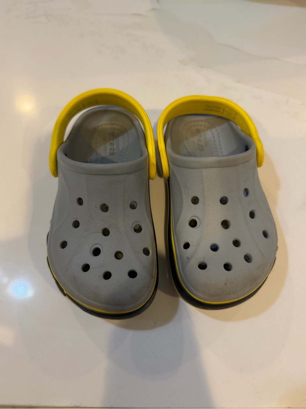 CROCS Kids Gray Clogs with Yellow Heel Strap